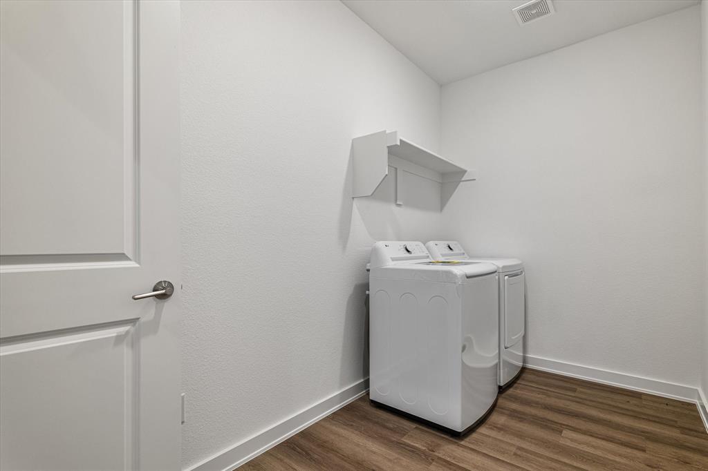 428 Cirrus Circle Muenster, TX 76252 - Photo 24 of 30 a utility room with wooden floor washer and dryer