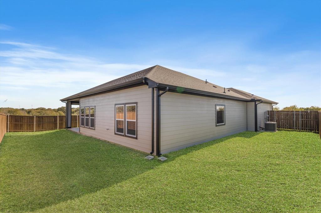 428 Cirrus Circle Muenster, TX 76252 - Photo 27 of 30 a backyard of a house with wooden fence