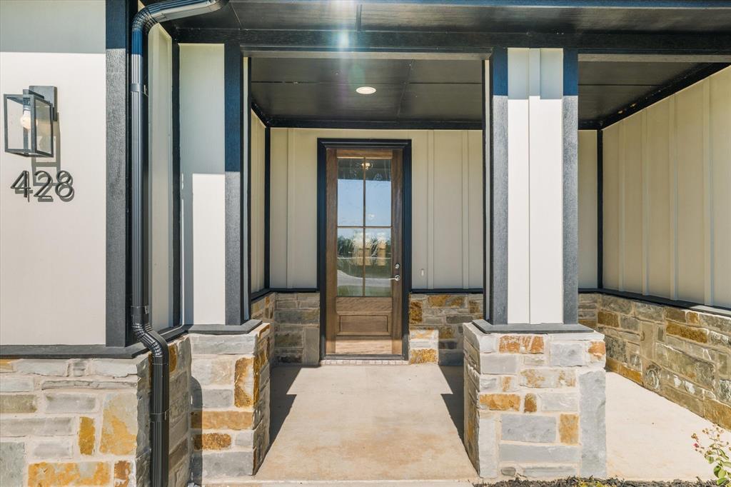 428 Cirrus Circle Muenster, TX 76252 - Photo 30 of 30 a bathroom with a tub and a large mirror