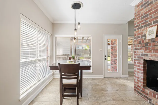 a dining room with furniture and window