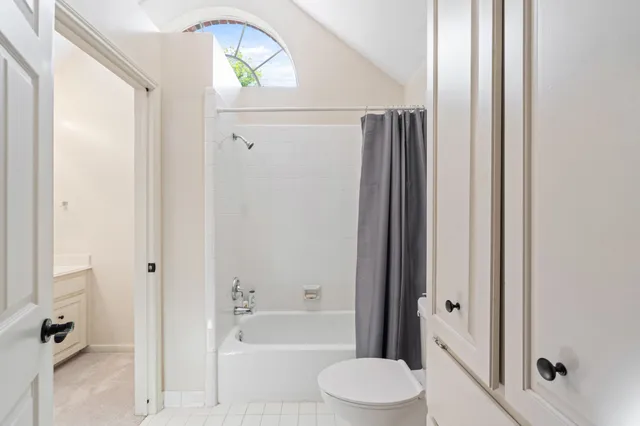 a bathroom with a bathtub a toilet and a shower