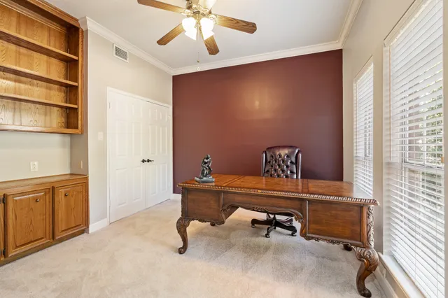 a view of a workspace with furniture