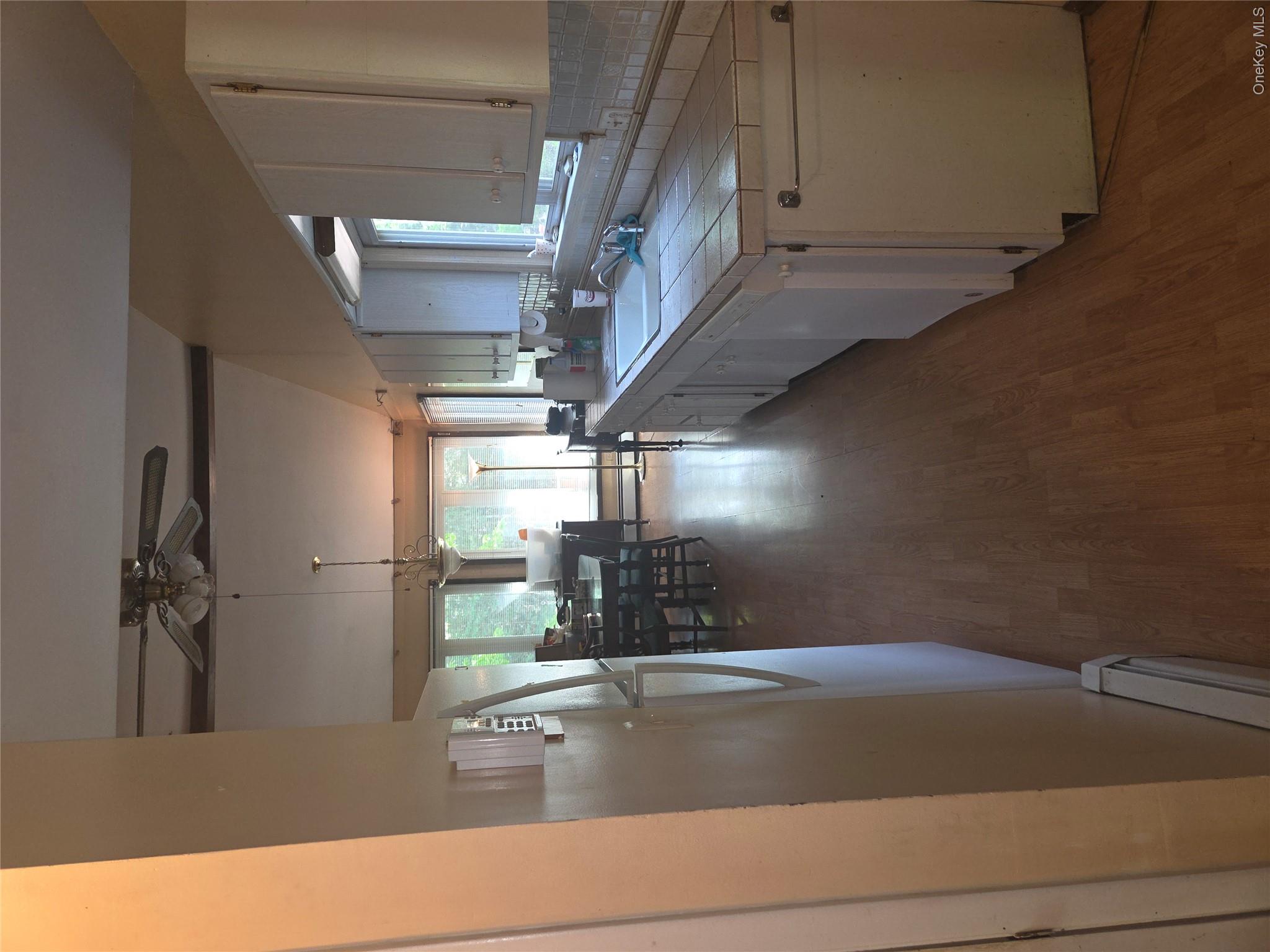 63 Otens Road Ellenville, NY 12428 - Photo 10 of 32 a kitchen with sink cabinets and window