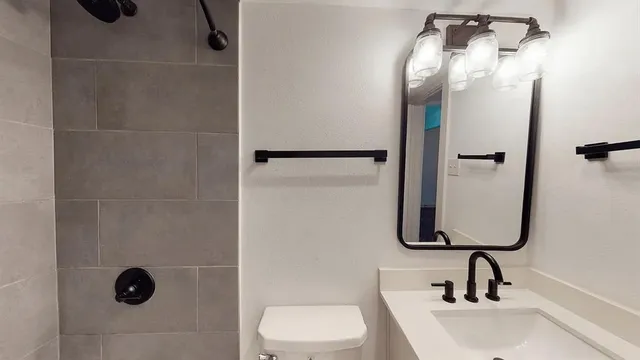 a bathroom with a sink and mirror