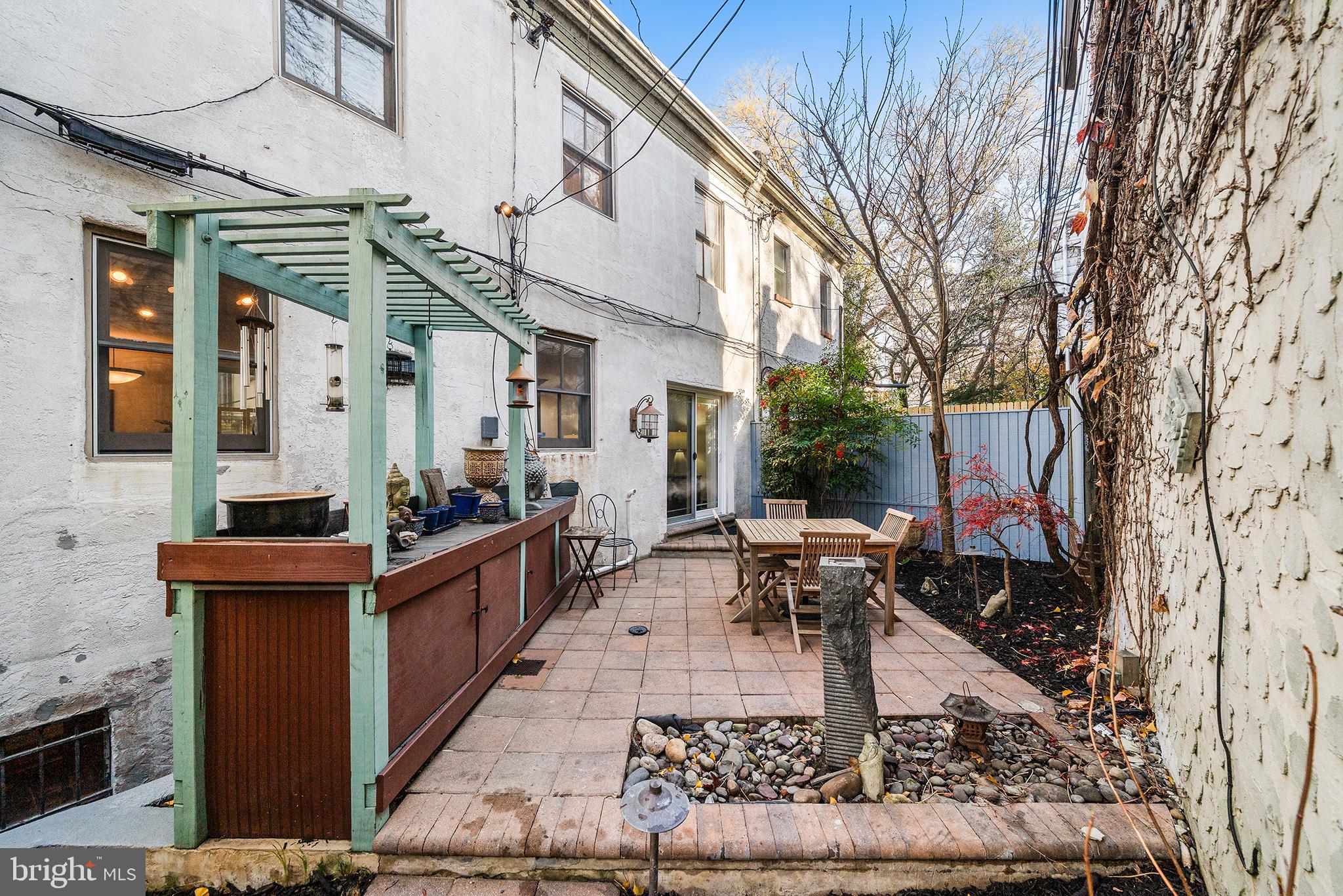 4 Rainey Court Philadelphia, PA 19103 - Photo 18 of 35 Charming outdoor patio with serene landscaping.