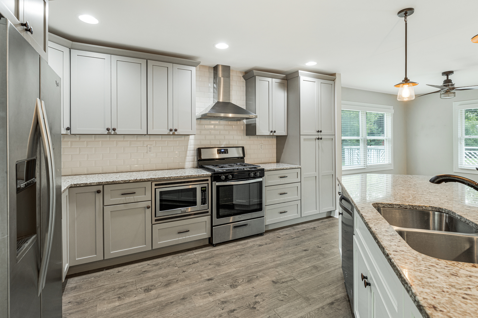 1N136 Pouley Road Elburn, IL 60119 - Photo 11 of 30 a kitchen with kitchen island granite countertop a sink stainless steel appliances and cabinets