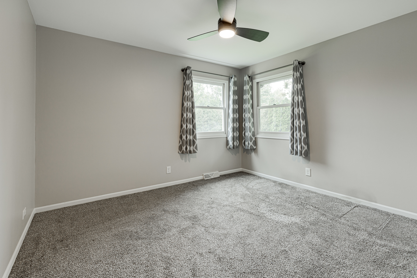 1N136 Pouley Road Elburn, IL 60119 - Photo 15 of 30 an empty room with windows and chandelier fan