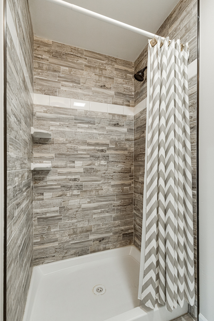1N136 Pouley Road Elburn, IL 60119 - Photo 17 of 30 a bathroom with a bathtub and shower