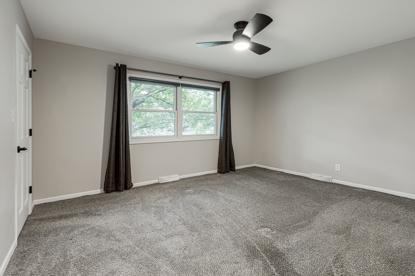 1N136 Pouley Road Elburn, IL 60119 - Photo 18 of 30 an empty room with chandelier fan and windows