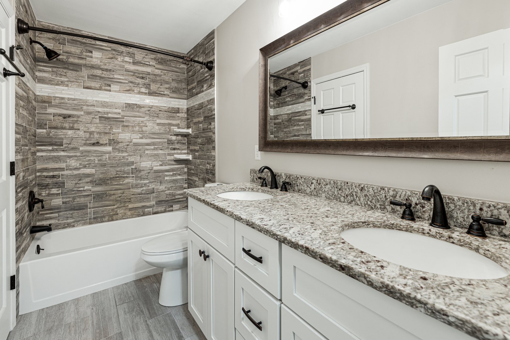 1N136 Pouley Road Elburn, IL 60119 - Photo 19 of 30 a bathroom with a granite countertop sink a toilet and bathtub