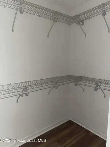 a view of a room with racks on the wall