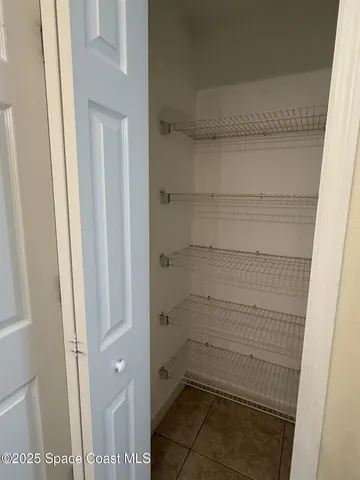 a bathroom with a glass door shower