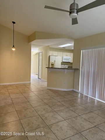 a view of a kitchen with a sink and cabinets