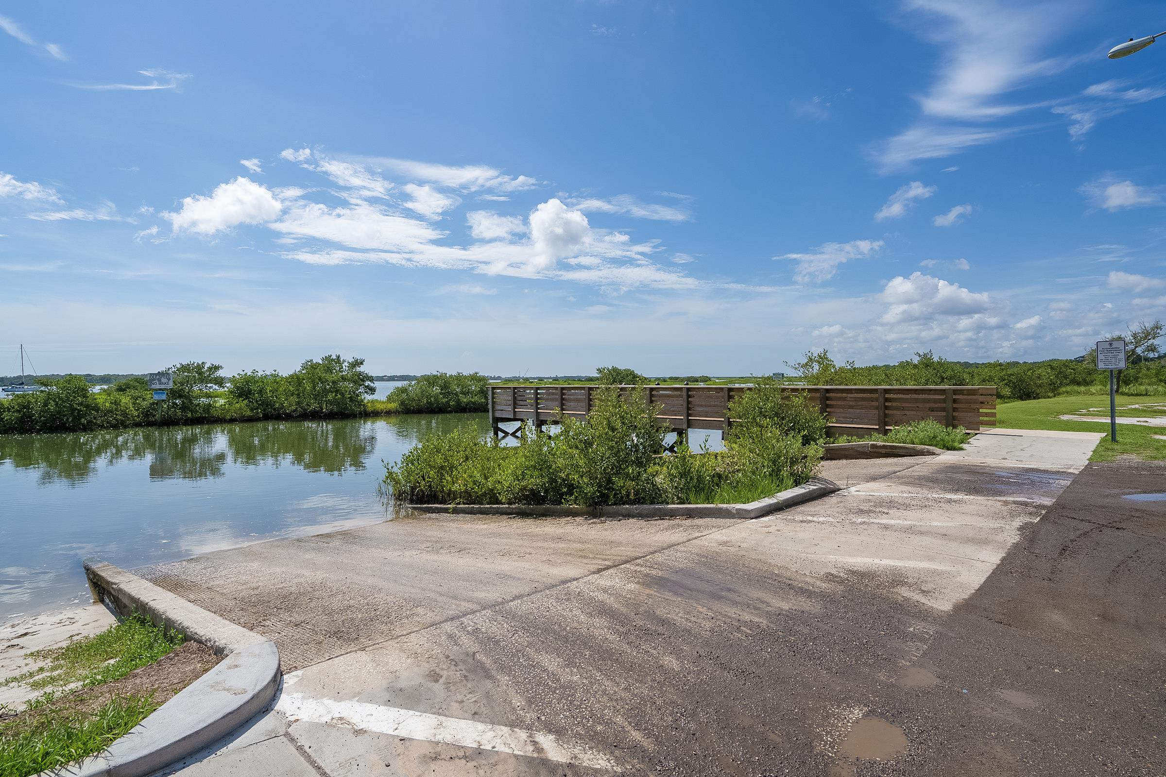 112 Hercules Road St. Augustine, FL 32086 - Photo 54 of 86 a view of a lake with a house in the background