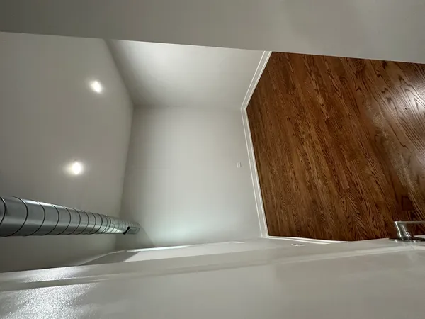 a lobby with a couch and a walk in closet
