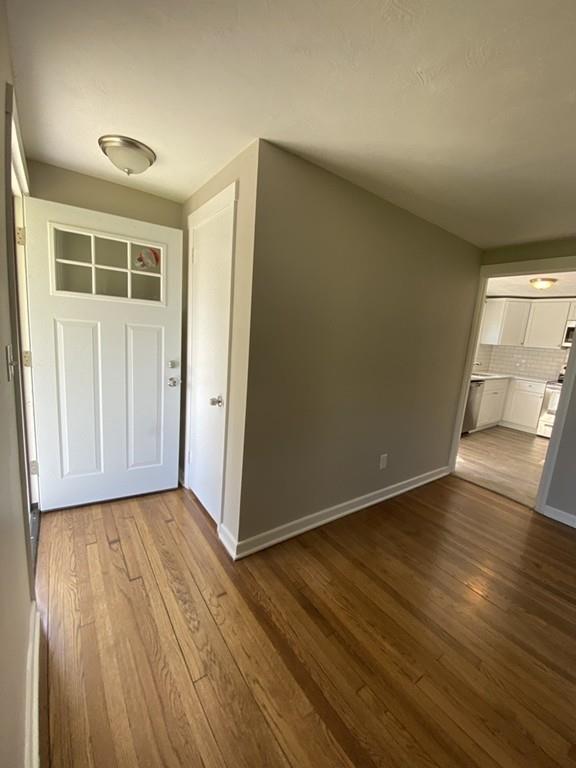 70 Plumtree Circle Springfield, MA 01118 - Photo 13 of 29 an empty room with wooden floor and windows