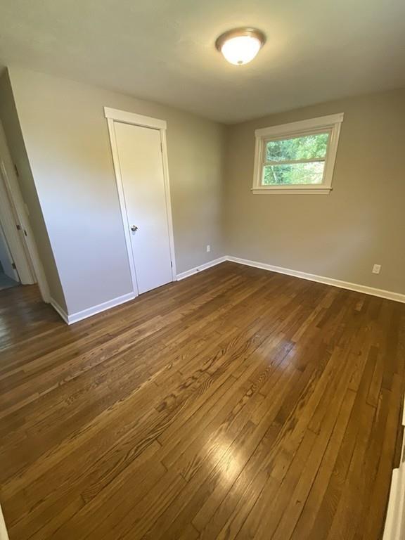 70 Plumtree Circle Springfield, MA 01118 - Photo 20 of 29 an empty room with wooden floor and windows