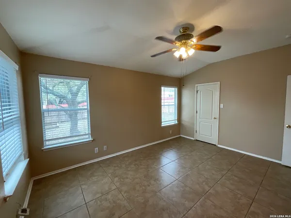a view of yard with wooden fence