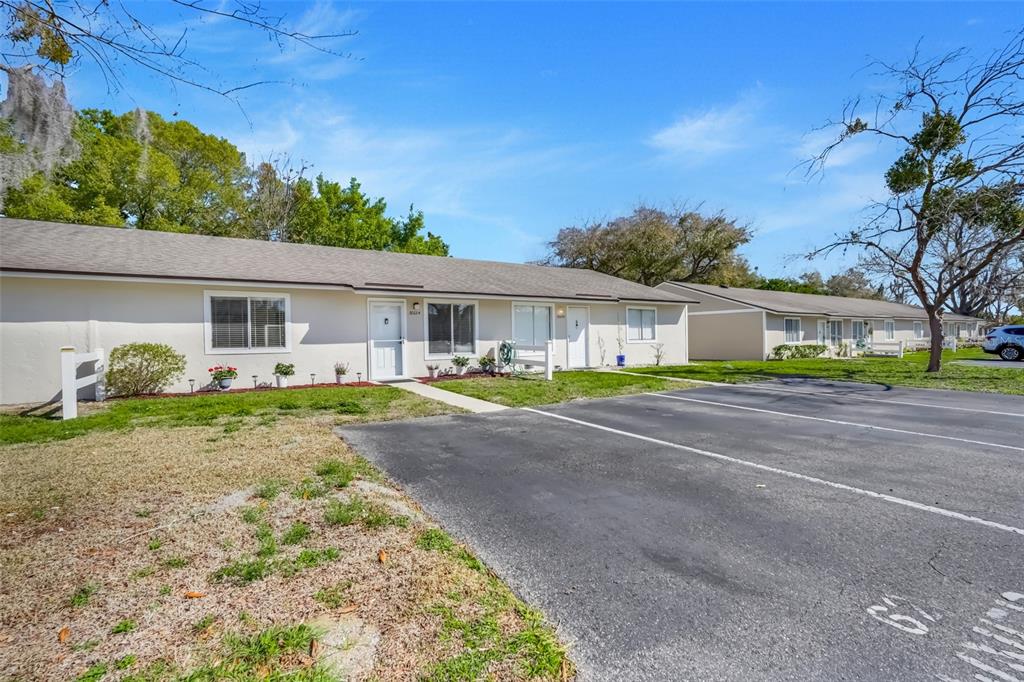 30024 Tavares Ridge Boulevard, Unit 62 Tavares, FL 32778 - Photo 2 of 31 a view of front of house with a yard
