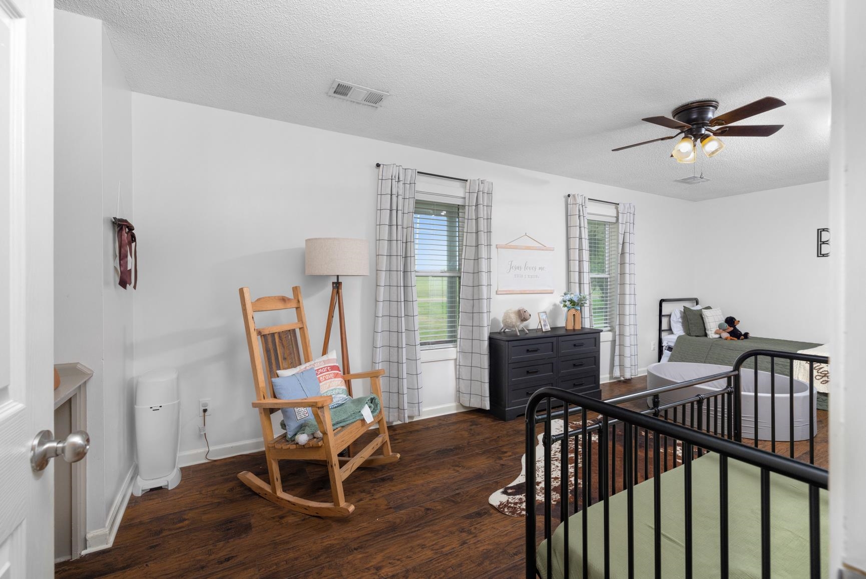 586 Beaver Road Munford, TN 38058 - Photo 9 of 21 Spacious room featuring wood-finish flooring, white walls, and a ceiling fan with integrated lighting