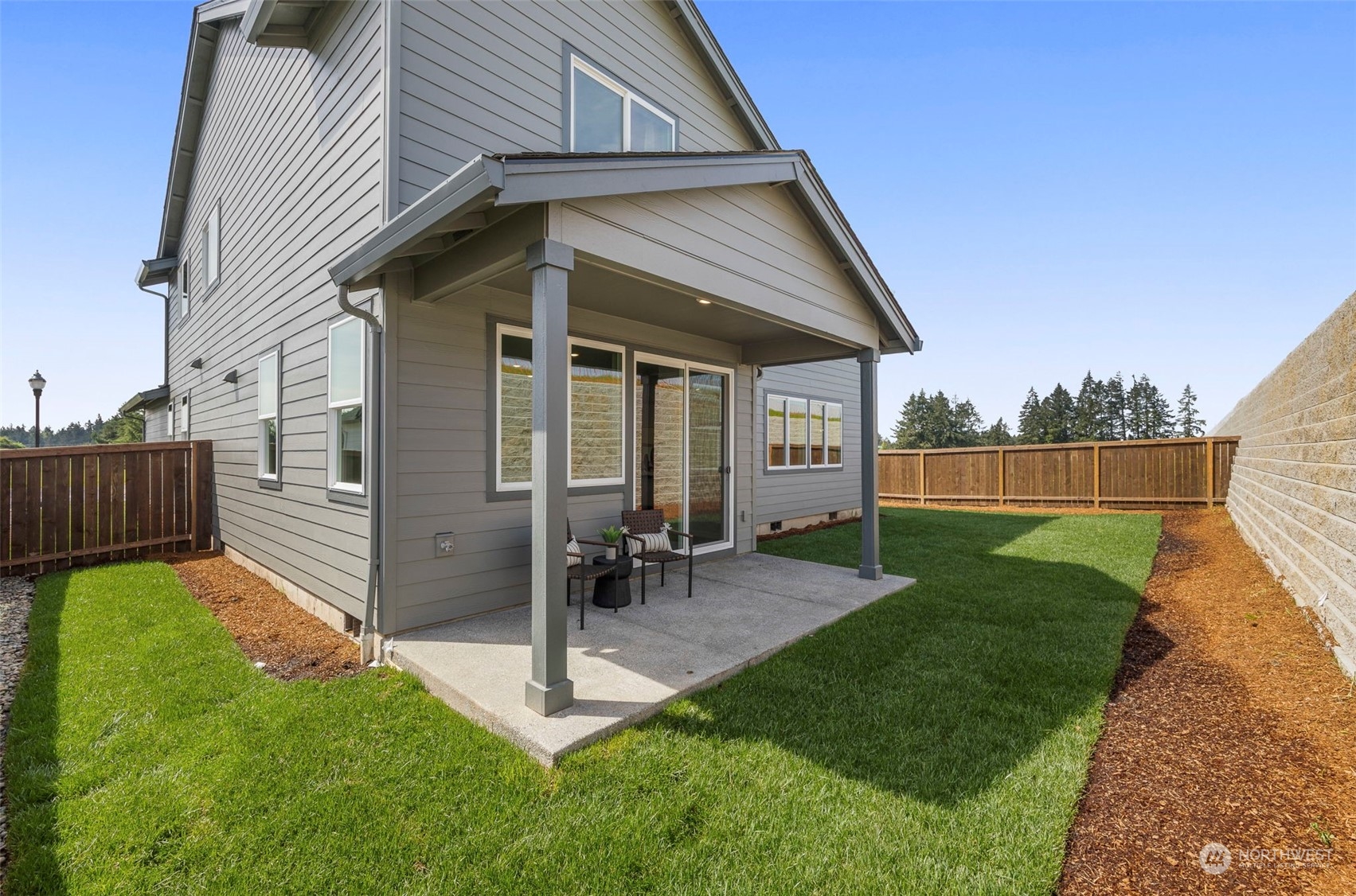 2801 South 7th Circle Ridgefield, WA 98642 - Photo 25 of 27 a view of a chair and table in backyard of the house
