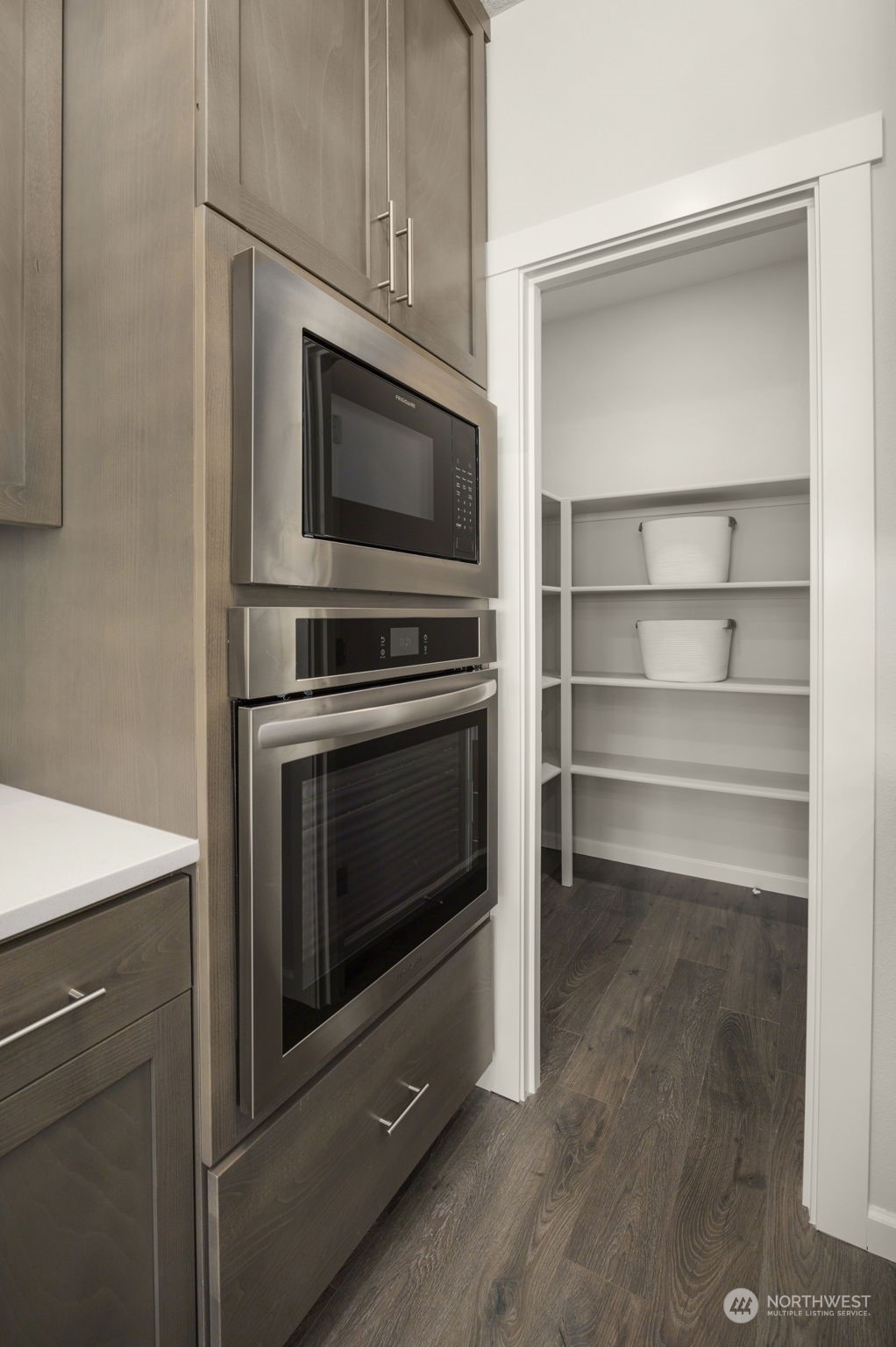 2801 South 7th Circle Ridgefield, WA 98642 - Photo 7 of 27 a kitchen with a stove and a microwave