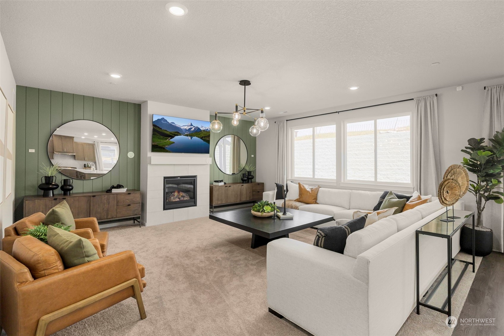 2801 South 7th Circle Ridgefield, WA 98642 - Photo 10 of 27 a living room with furniture a fireplace and a chandelier