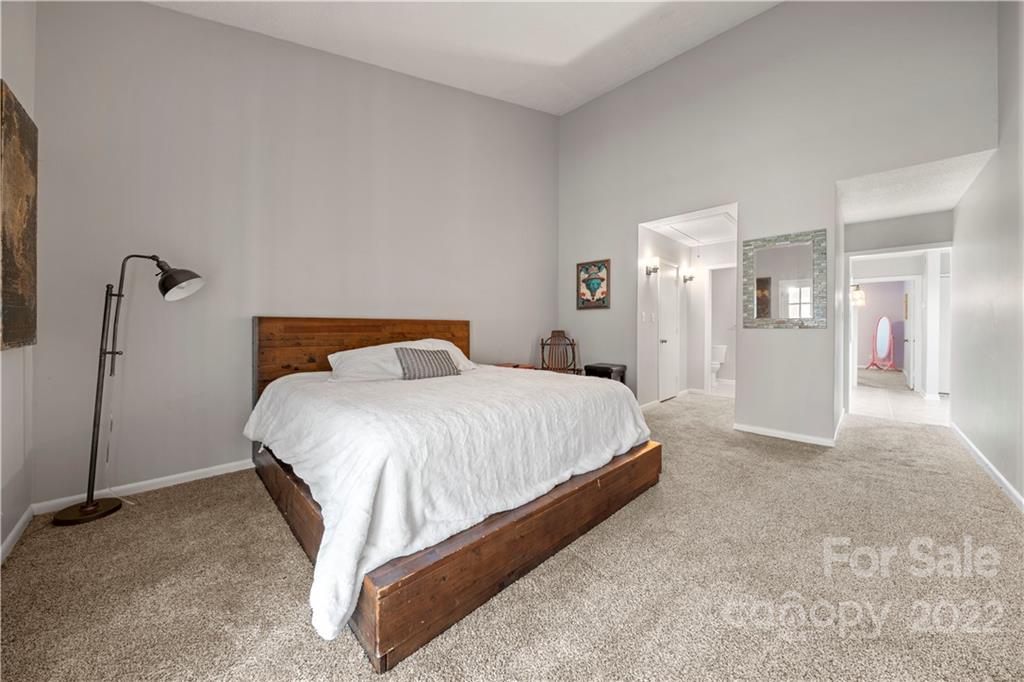32 Old Post Road Clover, SC 29710 - Photo 11 of 45 a spacious bedroom with a bed and a walk in closet