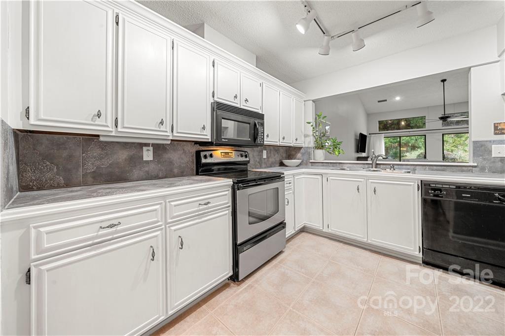 32 Old Post Road Clover, SC 29710 - Photo 24 of 45 a kitchen with granite countertop white cabinets white stainless steel appliances and a sink