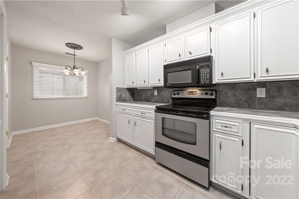 32 Old Post Road Clover, SC 29710 - Photo 25 of 45 a kitchen with granite countertop white cabinets and appliances