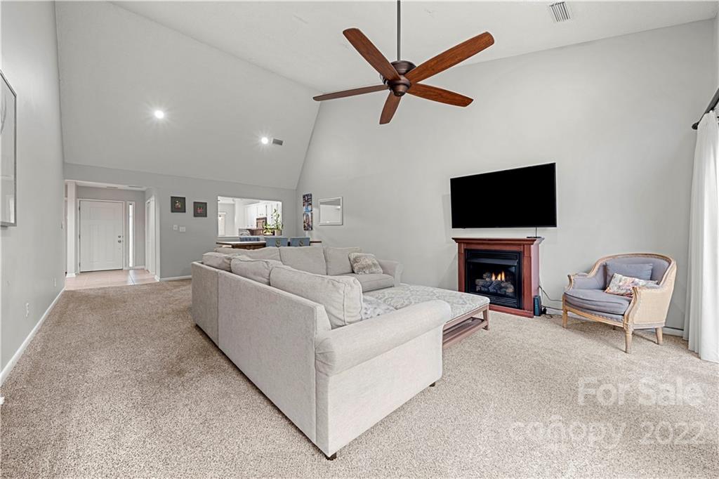 32 Old Post Road Clover, SC 29710 - Photo 30 of 45 a living room with furniture a fireplace and a flat screen tv
