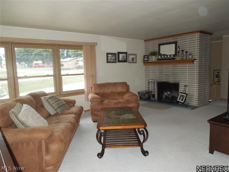 4604 5th Street Northwest Canton, OH 44708 - Photo 4 of 25 The beautiful brick fire place adds a cozy touch to the Living Room especially on those cold evenings!