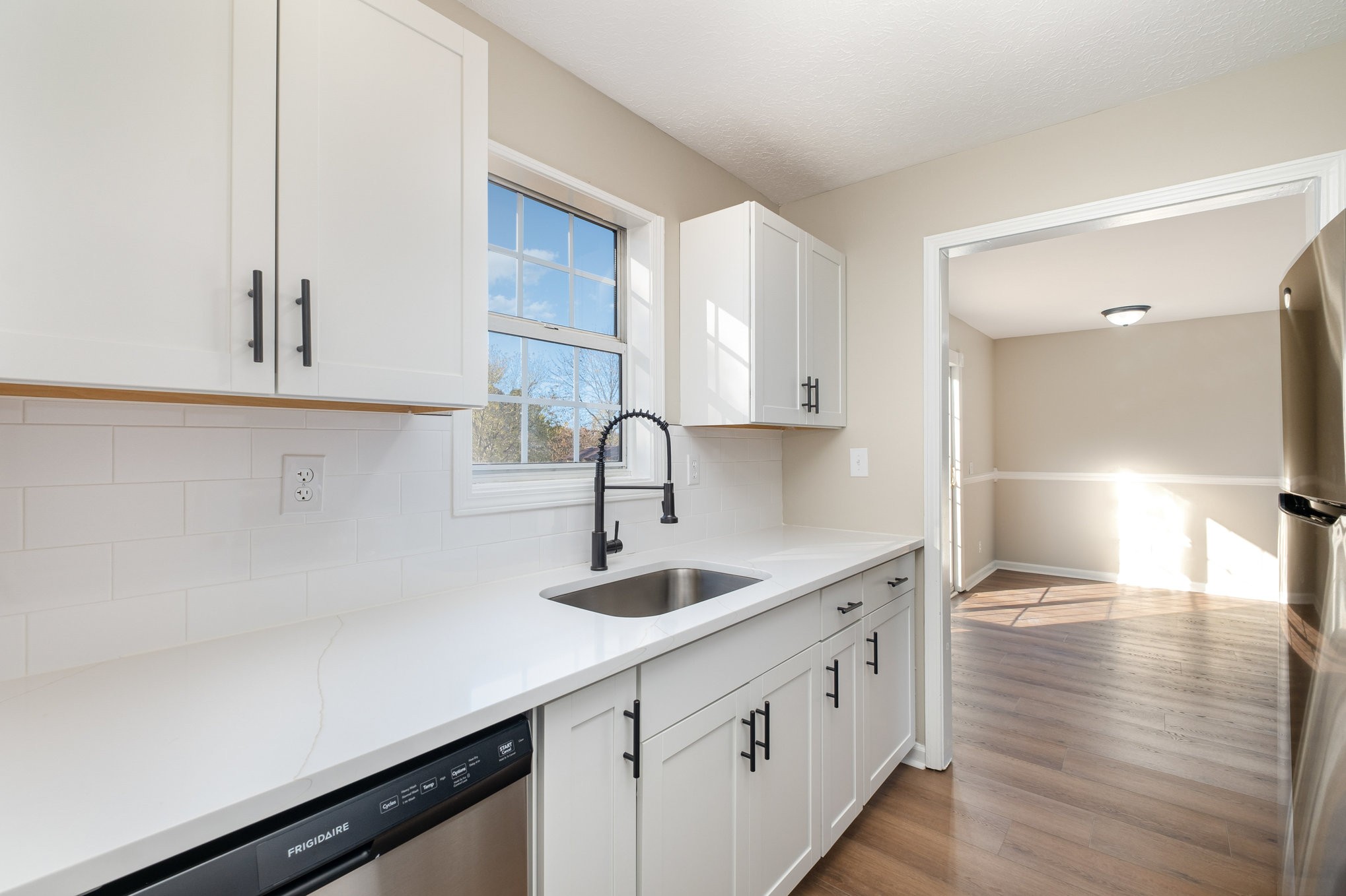 645 Airport Road Portland, TN 37148 - Photo 7 of 27 a kitchen with granite countertop white cabinets and a sink