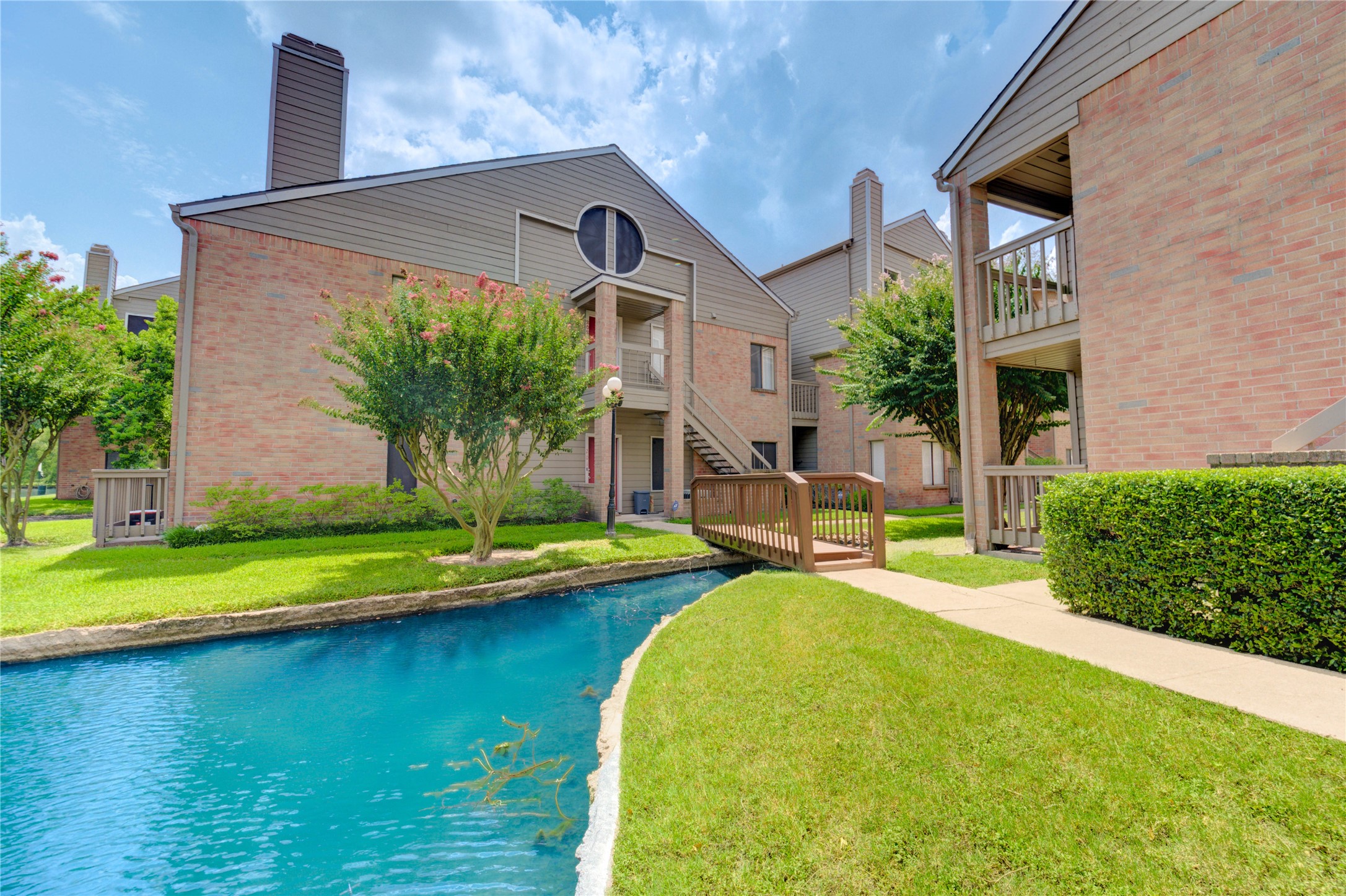 2023 Gentryside Drive, Unit 202 Houston, TX 77077 - Photo 12 of 50 a front view of a house with swimming pool having outdoor seating