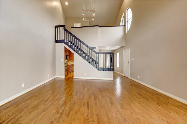 a view of an entryway with wooden floor