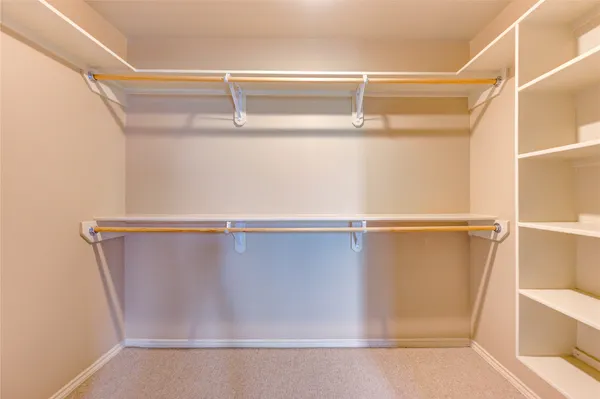 a view of an empty walk in closet
