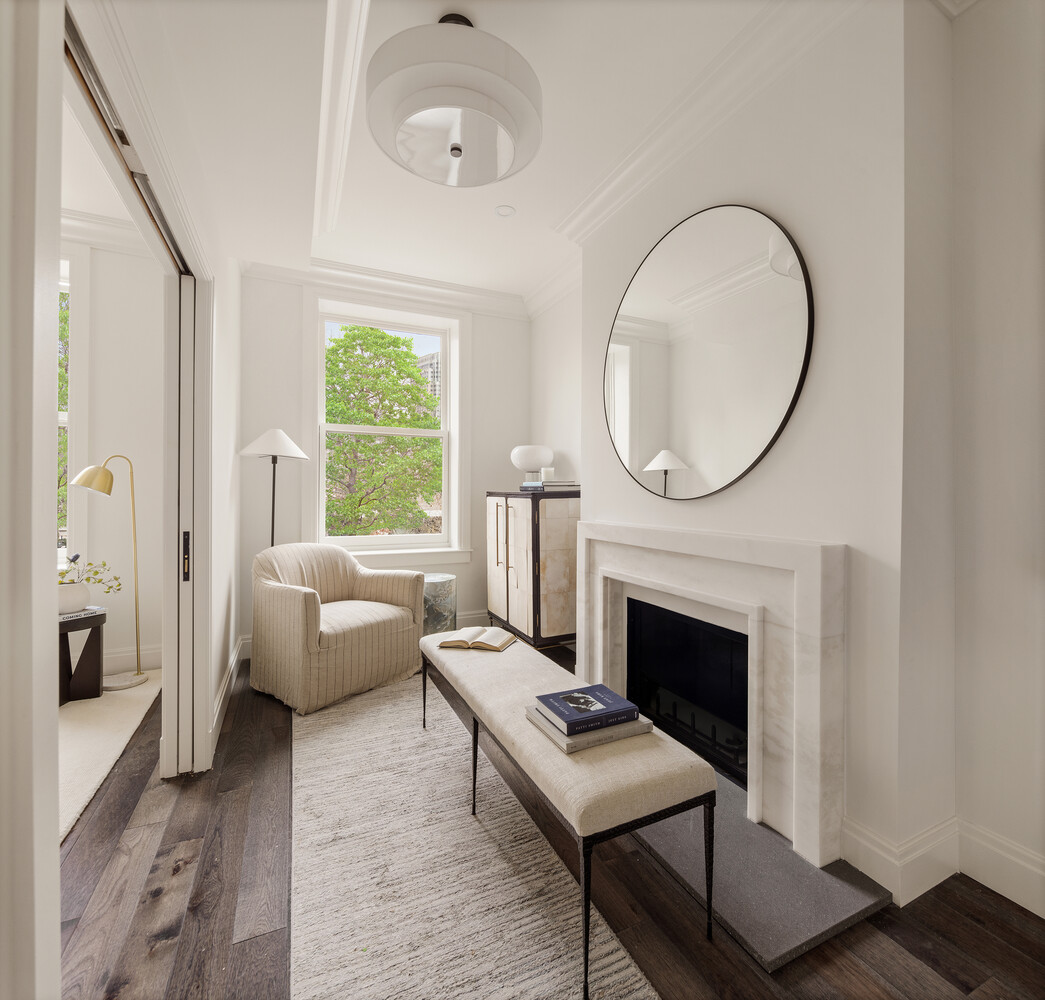 1 Monroe Place Brooklyn, NY 11201 - Photo 11 of 31 a living room with furniture a fireplace and a large window