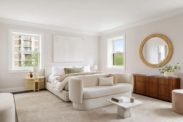 a bed room with a bed and a window