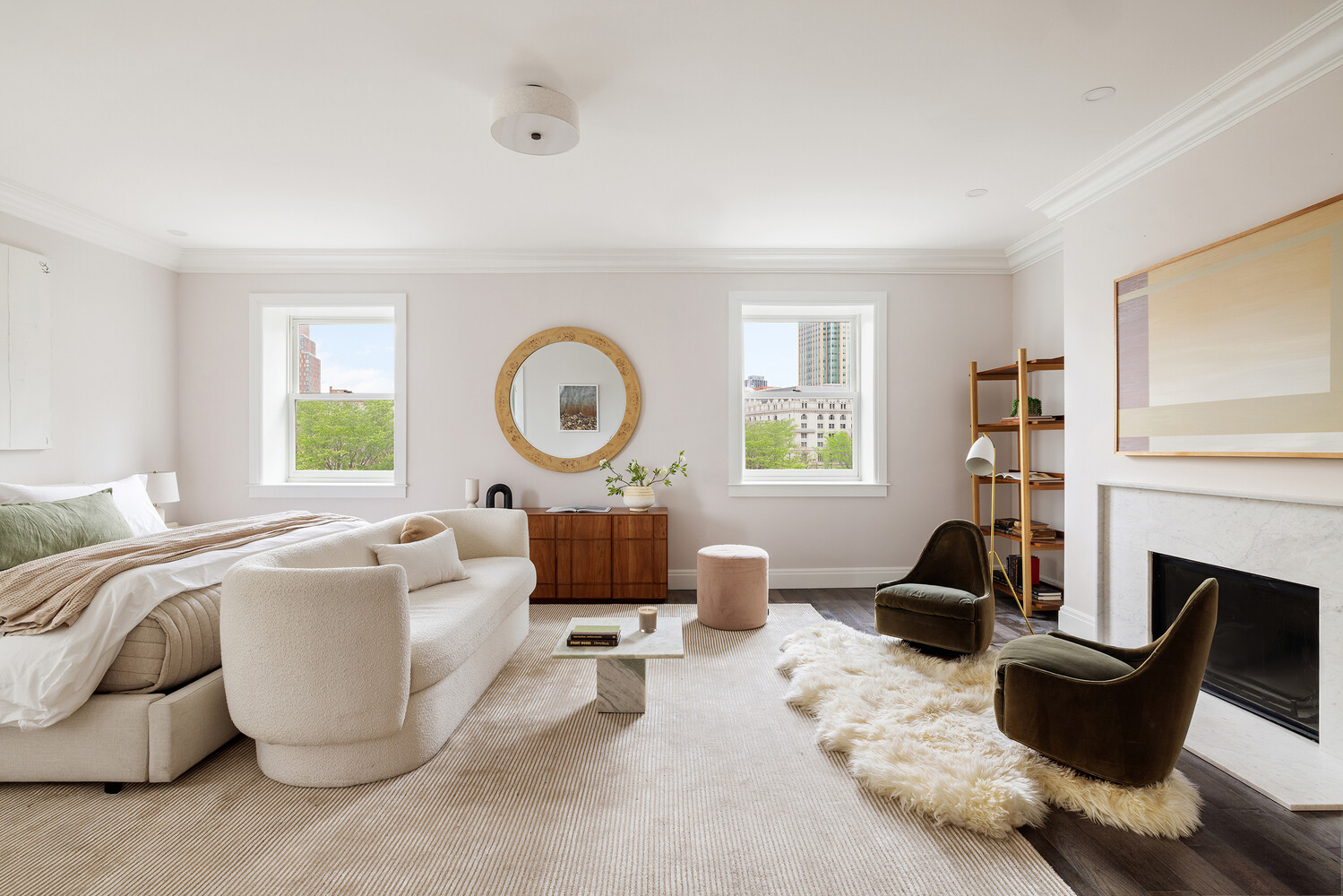 1 Monroe Place Brooklyn, NY 11201 - Photo 14 of 31 a living room with furniture a fireplace and a large window