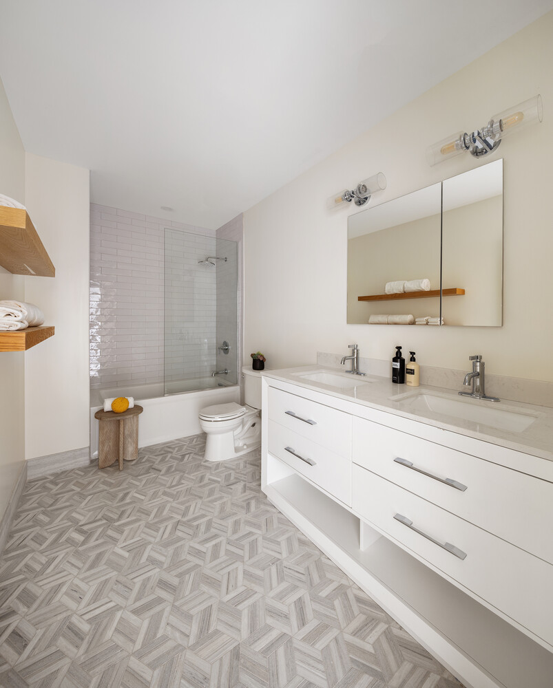 1 Monroe Place Brooklyn, NY 11201 - Photo 18 of 31 a bathroom with a double vanity sink toilet and a mirror