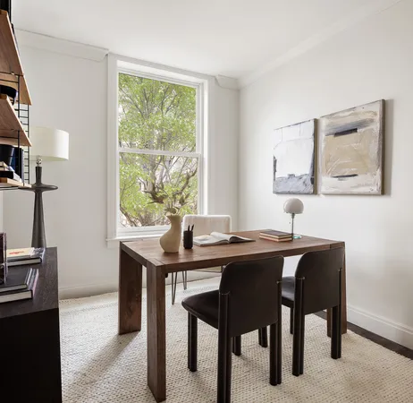 a view of a workspace with furniture