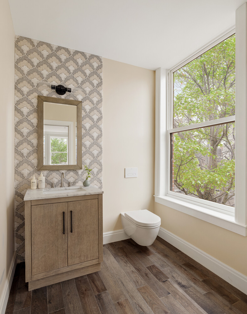 1 Monroe Place Brooklyn, NY 11201 - Photo 25 of 31 a bathroom with a granite countertop sink a toilet and a window