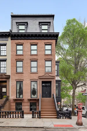 a street sign on a pole on a street