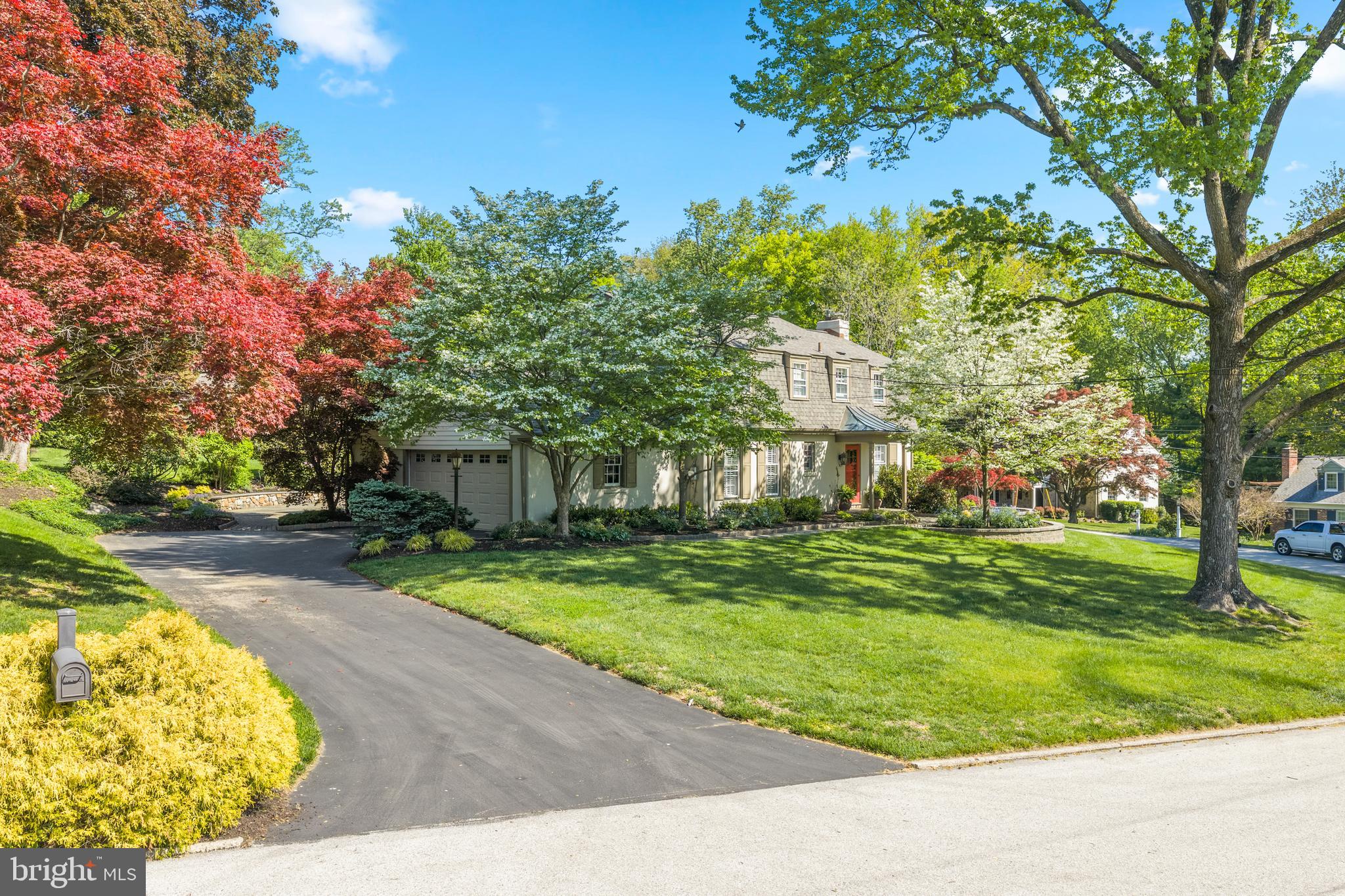 977 Ivycroft Road Wayne, PA 19087 - Photo 2 of 38 a front view of a house with a yard