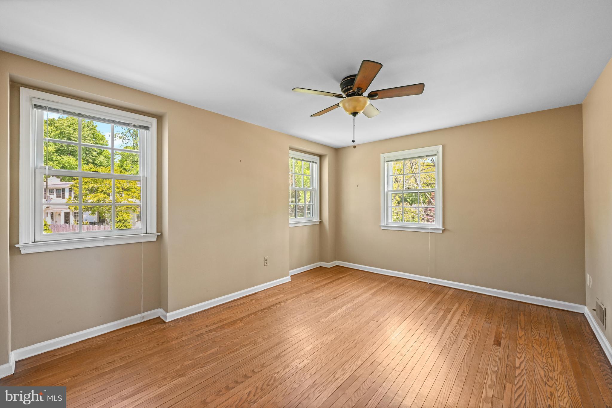 977 Ivycroft Road Wayne, PA 19087 - Photo 29 of 38 a view of empty room with wooden floor and fan