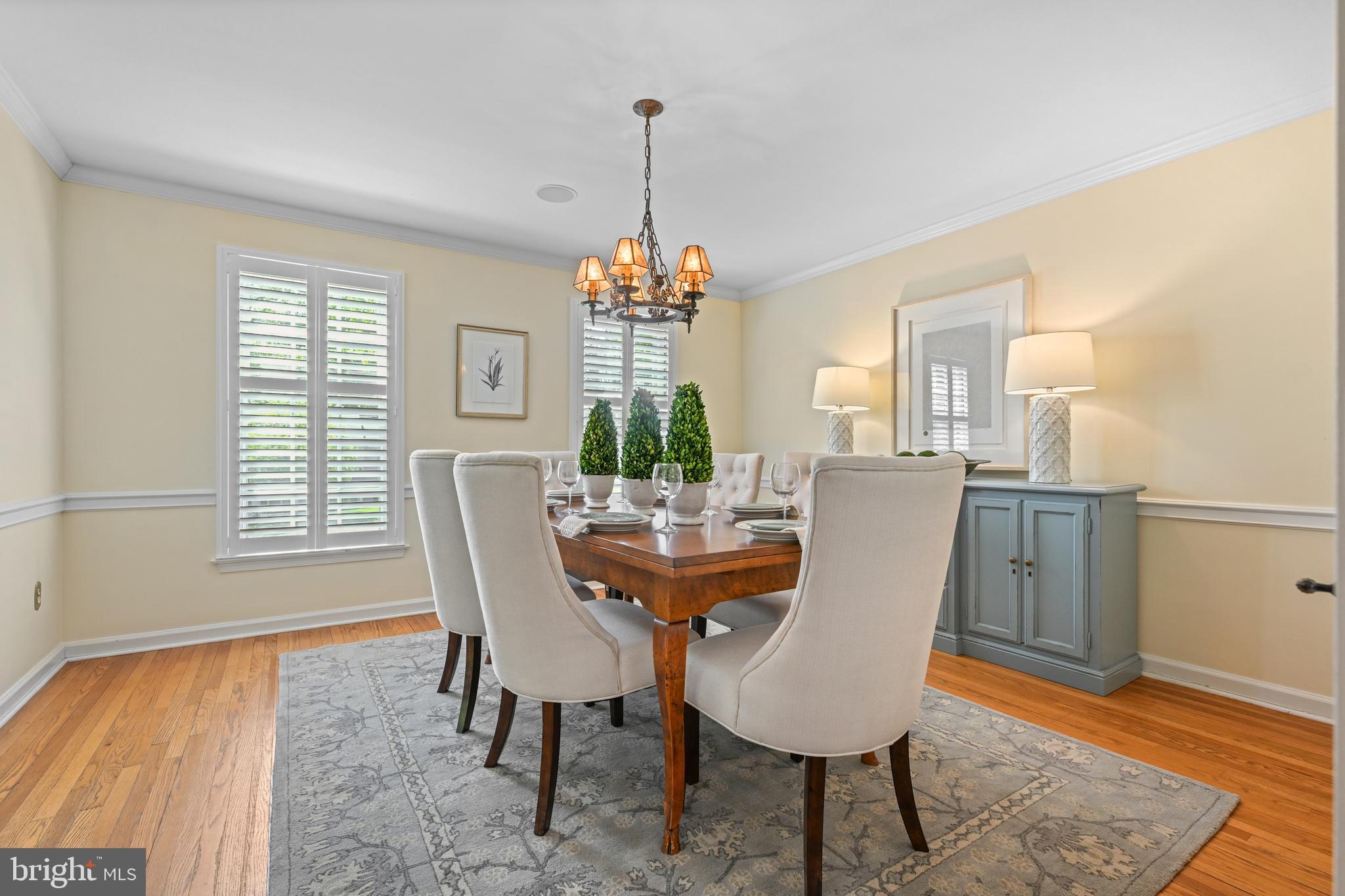 977 Ivycroft Road Wayne, PA 19087 - Photo 7 of 38 a dining room with furniture a chandelier and wooden floor