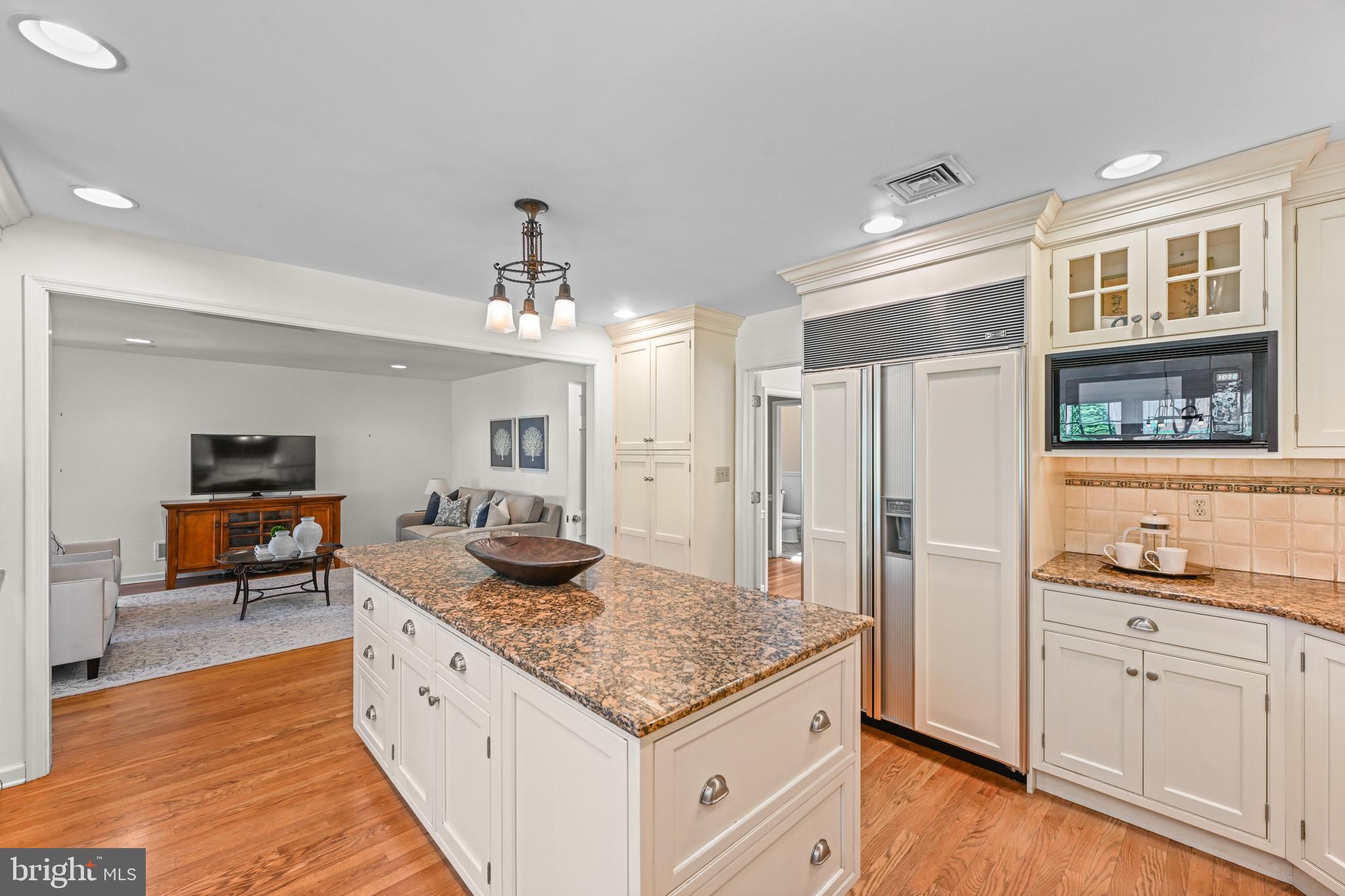 977 Ivycroft Road Wayne, PA 19087 - Photo 10 of 38 a kitchen with granite countertop kitchen island stainless steel appliances a sink stove and refrigerator