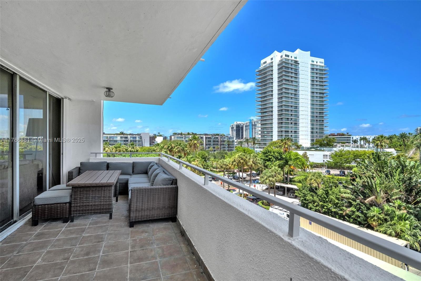 11 Island Avenue, Unit 512 Miami Beach, FL 33139 - Photo 16 of 54 a balcony with tall trees