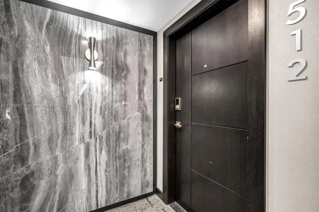 a view of hallway with wooden floor