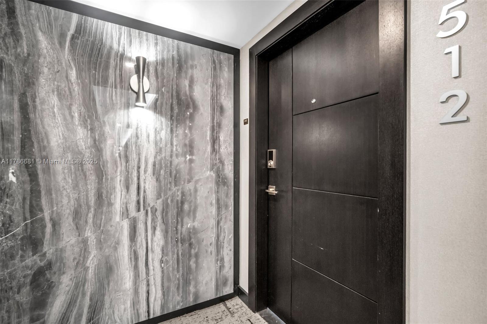 11 Island Avenue, Unit 512 Miami Beach, FL 33139 - Photo 21 of 54 a bathroom with a glass shower door and a window